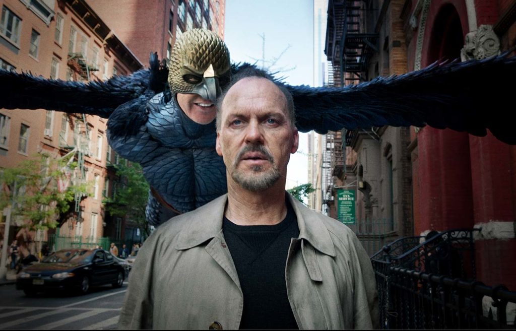 In Birdman, Michael Keaton plays both the actor Riggan Thomson, who is having an identity crisis, and his alter ego, Birdman, who badgers him because he gave up a lucrative Hollywood career for a play in an old Broadway theater.